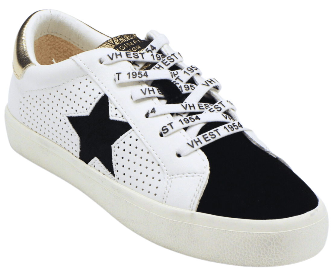 Sneakers with stars on top them